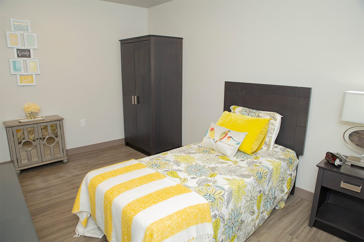 Resident rooms include a wardrobe for storage.