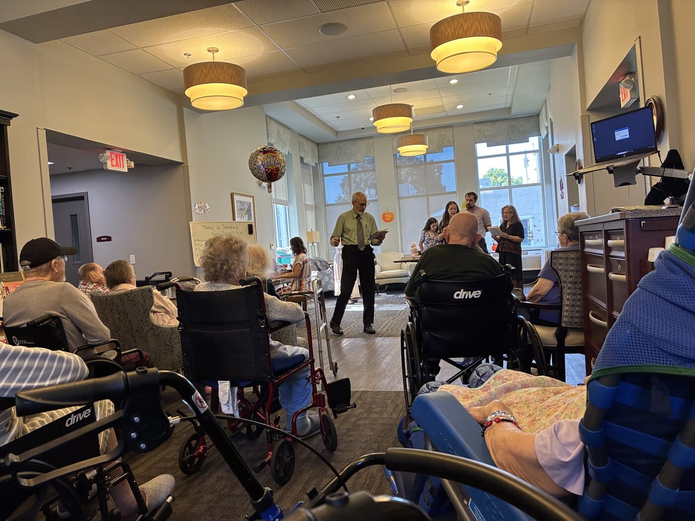 Residents listening to live music
