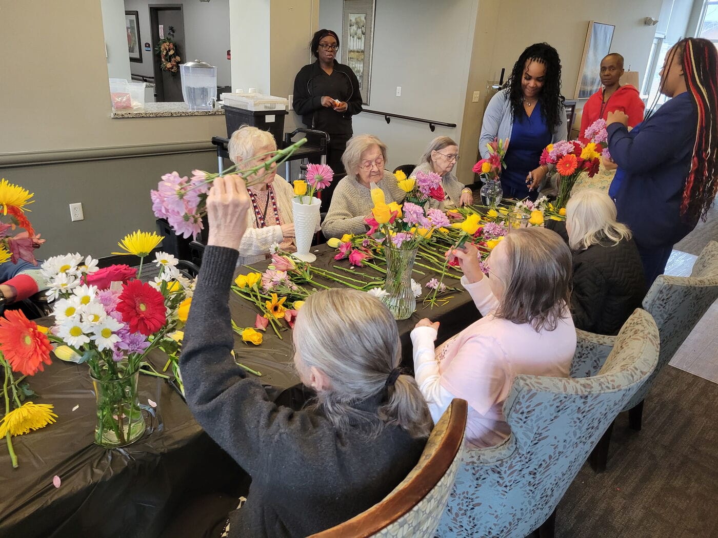 Residents arranging flowers