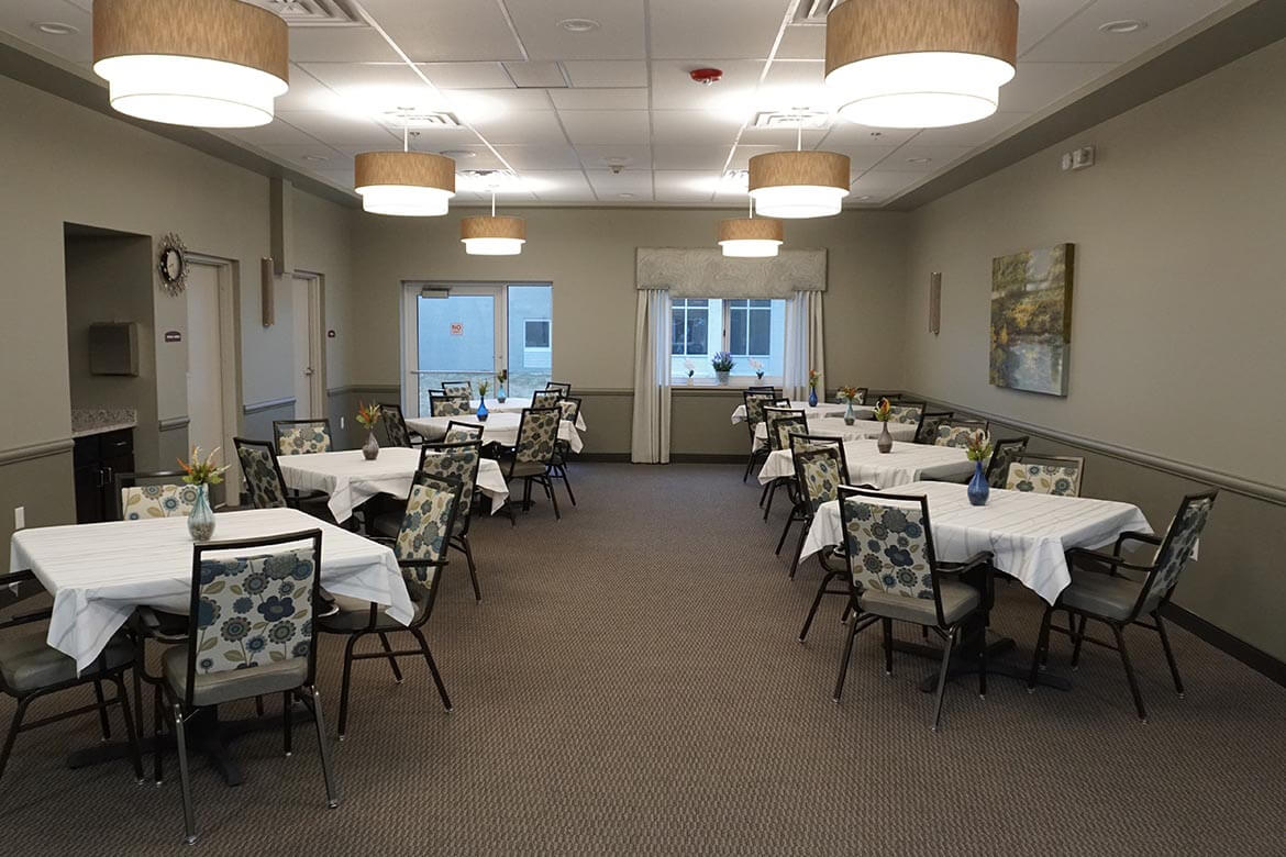 Residents enjoy meals and conversation in our spacious dining room.
